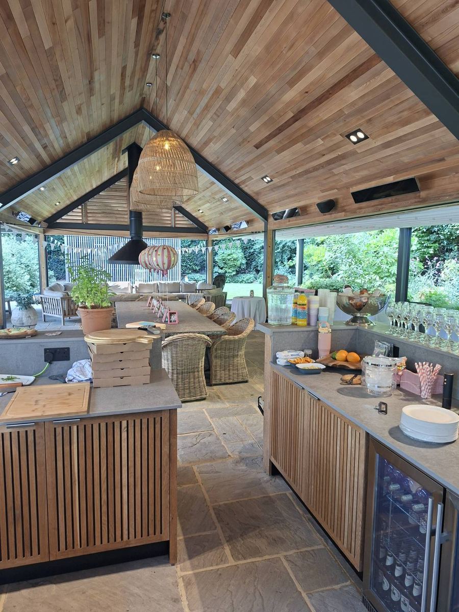 Outdoor garden kitchen set up for a private pizza party